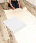 Person preparing to apply Clear Waterproof Self Adhesive Wallpaper Roll Removable Heat Resistant Kitchen Backsplash Tiles Protector.