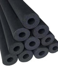 Stacked foam tubes from Multi Size Pipe Insulation Foam Tubing Kit with inner diameters from 1/4 to 4-1/3 inches, black material.
