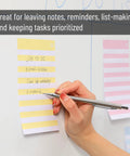Person writing on Lined Sticky Notes 4x6 Inch, 6 Pads With 45 Sheets Each, horizontal lines for neat writing, office use