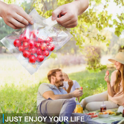 Hands holding Meal Prep Ready Vacuum Sealer Bags For Food Storage 6x8 Inch 15x20 Cm Precut with cherries in picnic setting