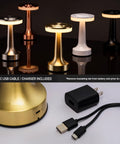 Portable Dope LED Table Lamp With Touch Sensor Three Levels Of Brightness Rechargeable Battery Lasting Up To 48 Hours Night Light For Kids And Nursery Perfect Nightstand Or Bedside Lamp In Gold, shown with USB charger and cable.