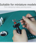 Painting Handle For Miniatures And Scale Models, Clamp Holder That Grips 25mm To 45mm Bases, shown holding a model for painting.