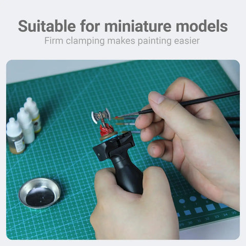 Painting Handle For Miniatures And Scale Models, Clamp Holder That Grips 25mm To 45mm Bases, shown holding a model for painting.