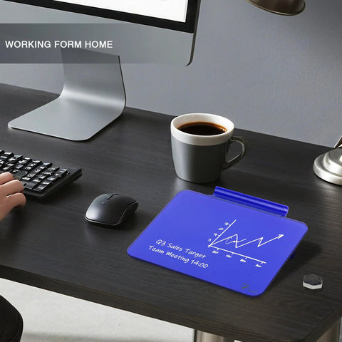Navy Blue Glass Desktop Whiteboard Mini 8x6 Inch with Pen Holder on desk next to computer and coffee cup, modern office setup.