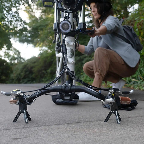 Handlebar Jack Portable Repair Stand V3 for Ebikes with complete gear bundle in use, securing bike handlebars outdoors.
