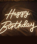 Two Piece Happy Birthday LED Neon Sign Set 24 Inch And 18 Inch Warm White Glow illumination on a dark backdrop.