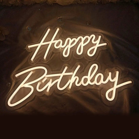Two Piece Happy Birthday LED Neon Sign Set 24 Inch And 18 Inch Warm White Glow illumination on a dark backdrop.