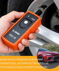 Expert Grade Tpms Relearn Tool And Tire Pressure Sensor Activation Programmer EL 50448 OEC T5 held near a tire valve for activation.