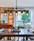 Five Light Modern Farmhouse Arched Kitchen Island Light 27 Inch Linear Chandelier With Seeded Glass Shades In Black Finish For Dining Room Or Pool Table ETL Listed Two Year Warranty Showroom Ready over dining table