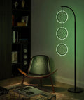 Dope RGB Color Changing Floor Lamp With Arching Three-Ring Pendant in living room, black finish, modern and contemporary design.
