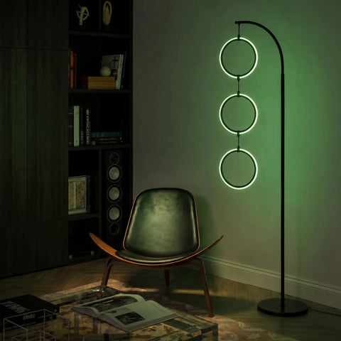 Dope RGB Color Changing Floor Lamp With Arching Three-Ring Pendant in living room, black finish, modern and contemporary design.