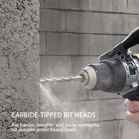Side view of a carbide-tipped masonry drill bit installed in a rotary hammer drill, drilling into a concrete block.