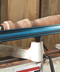 12-inch lathe tool rest with 1-inch post, blue stainless steel mounted on a wood lathe