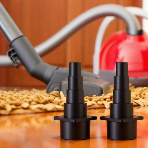 Four Pack Vacuum Hose Adapters Set For Universal Tool Attachments And Dust Collection in front of a vacuum cleaner on carpet
