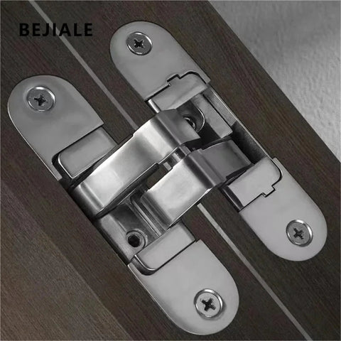 Close-up of Hidden Cross Hinge For Invisible Doors With Three Dimensional Adjustable Mechanism 180 Degree Flat Folding Wooden Door Hardware Left Large Model Easy Install Concealed Pivot System One Color Finish Durable Interior Room Divider Solution, showcasing stainless steel material and installation details.
