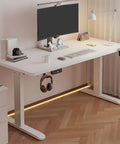 Electric Height Adjustable Standing Desk, Three Memory Presets, Anti Collision Motor, sleek white office setup with headphones hook.