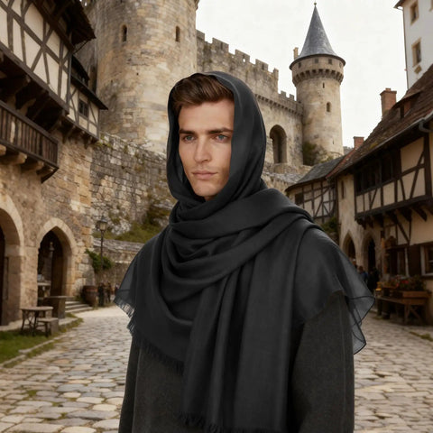 Man in black cloak with castle backdrop, representing Epic Seven Piece Renaissance Costume Set For Men With Faux Leather Pauldron