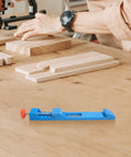 Blue Electric Circular Saw Milling Positioning Clamp With Adjustable Base Guide for woodworking, shown on a wooden table.