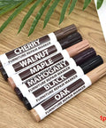 Set of furniture wood repair markers in various colors, including a black marker for easy DIY scratch fix on floors and tables.