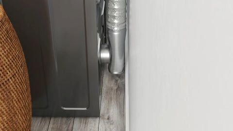 4 Inch Aluminum Dryer Offset Connector For Electric Dryers, Silver Finish, installed in tight space behind dryer