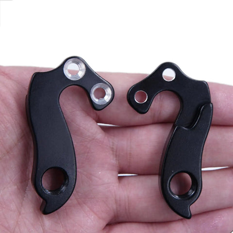 Derailleur Hanger 61 Replacement For Mountain Bikes, CNC Aluminum Alloy Rear Mech Dropout Upgrade held in hand