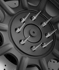 Close-up of Spike Lug Nuts 14mmx1.5 Chrome 32 Piece Set With Closed End 60 Degree Cone Seat on wheel