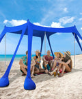 Beach Tent Sun Shelter 10x10ft Portable Shade Canopy UPF50 with people sitting underneath on a sunny beach