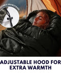 Person sleeping in XXL Winter Sleeping Bag For Adults And Kids, 4 Season Cold Weather Camping Gear with Draft Collar, in tent.