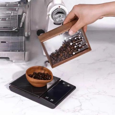 Rugged Wood Coffee Sealed Storage Can With One Way Valve Keeps Your Daily Roast Crisp And Shuts Out Stale Air Compact Square Layout, pouring beans into a wooden bowl on a scale.