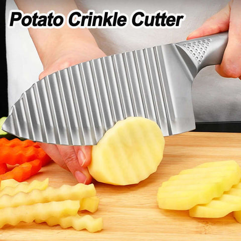 NOVANO stainless steel crinkle cutter, side view with ridged blade slicing a potato on a cutting board