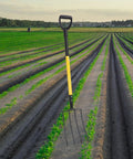 Long Handle Garden Spading Fork With Y Grip 4 Tine Metal Digging Fork For Gardening And Composting in a field