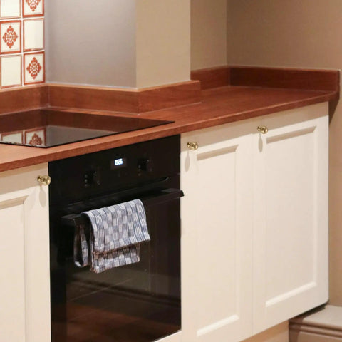 Champagne Bronze Cabinet Knobs 2 Pack Round Drawer Knobs on white kitchen cabinets with wood countertop
