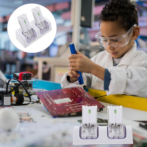 Dual Slot USB Rechargeable Battery Charging Dock For Game Controllers on table with child working on electronics
