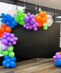 Epic Balloon Arch Kit 122 Pcs Colorful Balloon Garland Set in purple, dark blue, green, orange, transparent at a science birthday party.