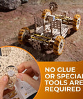 NASA Lunar Rover 3D Wooden Mechanical Puzzle Kit With Rotating And Pivoting Wheels, Spring Driven Motor, Automatic Unfolding, Rubber Tread Traction, Folding Twin Seats For Astronaut Figurines, 319 Parts Totally Epic Build Experience, assembled rover on rocky surface