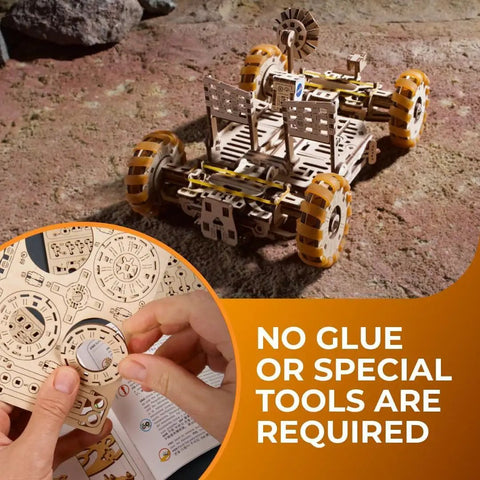 NASA Lunar Rover 3D Wooden Mechanical Puzzle Kit With Rotating And Pivoting Wheels, Spring Driven Motor, Automatic Unfolding, Rubber Tread Traction, Folding Twin Seats For Astronaut Figurines, 319 Parts Totally Epic Build Experience, assembled rover on rocky surface