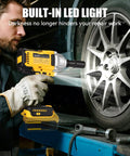 Pro Grade 1/2 Inch Cordless Impact Wrench Fits 20V Max Batteries in use on a tire, showcasing built-in LED light for detailed work.