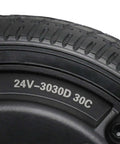 Close-up of 24V 250W Gearless Brushless Hub Motor with 6.5 inch solid tire wheel for scooter, showing tire details.