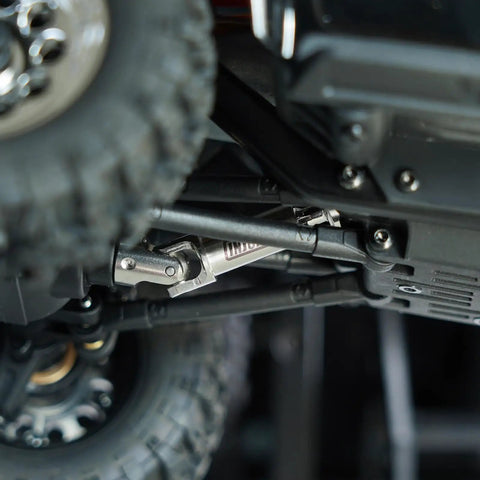 Premium Stainless Steel Center Drive Shafts For Hpi Venture 18 And Cr18p Rc Vehicles mounted in off-road vehicle chassis, showcasing durability.