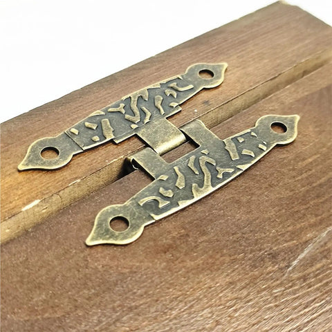 4Pcs Antique Vintage H Shaped Cabinet Door Hinges With Screws For Jewelry Boxes And Old School Furniture Decor on wooden surface