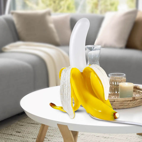 Dope Banana Table Lamp With LED Night Light on a white table in living room, Modern Resin Banana Lighting Fixture with Frosted Acrylic Shade