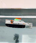 Super Cool RC Submarine Toy For Surface And Deep Water Diving floating in a glass tank, showing realistic diving action.
