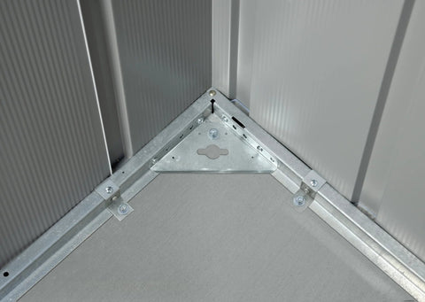 Concrete Anchor Kit AK100 for Shed Foundations and Mounting Durable Outdoor Sheds on concrete slab corner installation view.