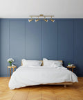 Sabrina 4-Light Matte Brass Track Lighting With Pivoting Heads in modern bedroom setting