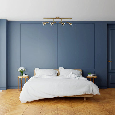 Sabrina 4-Light Matte Brass Track Lighting With Pivoting Heads in modern bedroom setting