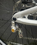 Close-up of Single Speed Chain Tensioner Kit For Hardtail MTB BMX DJ And Folding Bikes, CNC 6061 Aluminum, mounted on bike frame.