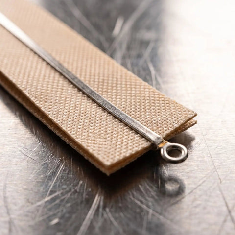 Close-up of a 5 Piece Hand Sealer Heating Strips Fast Heat Replacement Element with metal strip and fabric backing.