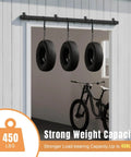 8 Foot Exterior Sliding Barn Door Hardware Kit with 450Lb Capacity, black steel box rail, holding tires in an open doorway