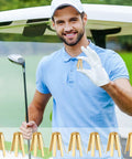 Man holding brass golf shaft adapter shim, showcasing Boss Level Twenty Pack Brass Golf Shaft Adapter Shims For Three Thirty Five To Three Seventy Drivers Irons.