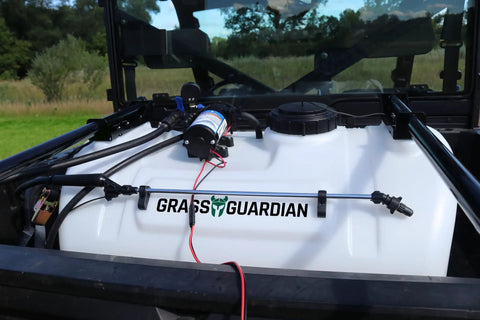 40 Gallon UTV Broadcast Sprayer With 2.2 GPM Diaphragm Pump and 10 Foot Swath attached to a UTV in a field